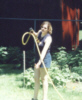Cynthia with a hose trying to clean up soem puke